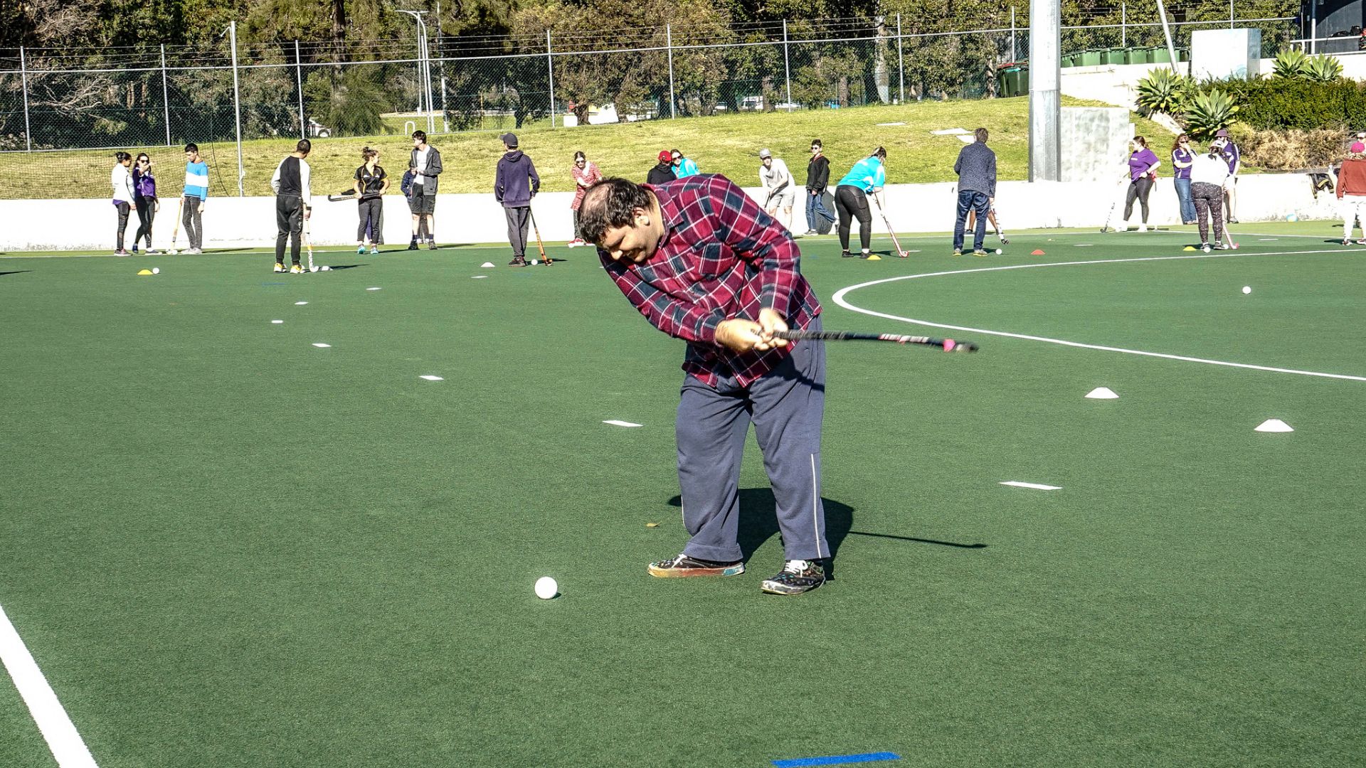 Participant playing golf.